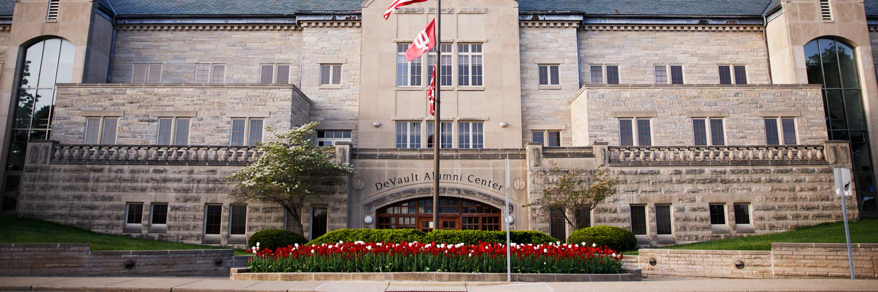 A glamorous early morning spring photo of the Devault Alumni Center, the University Events team's home base. 