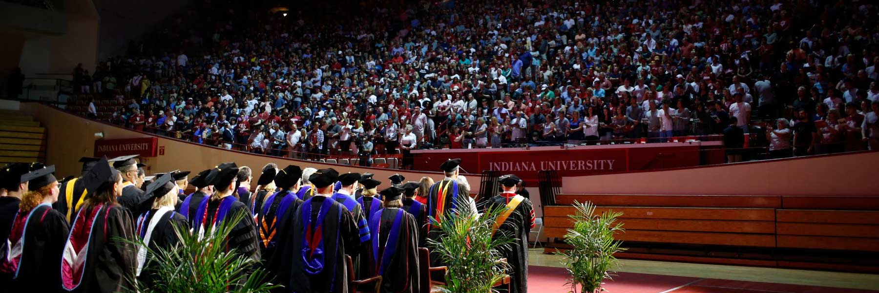A group of people standing in a stadium.